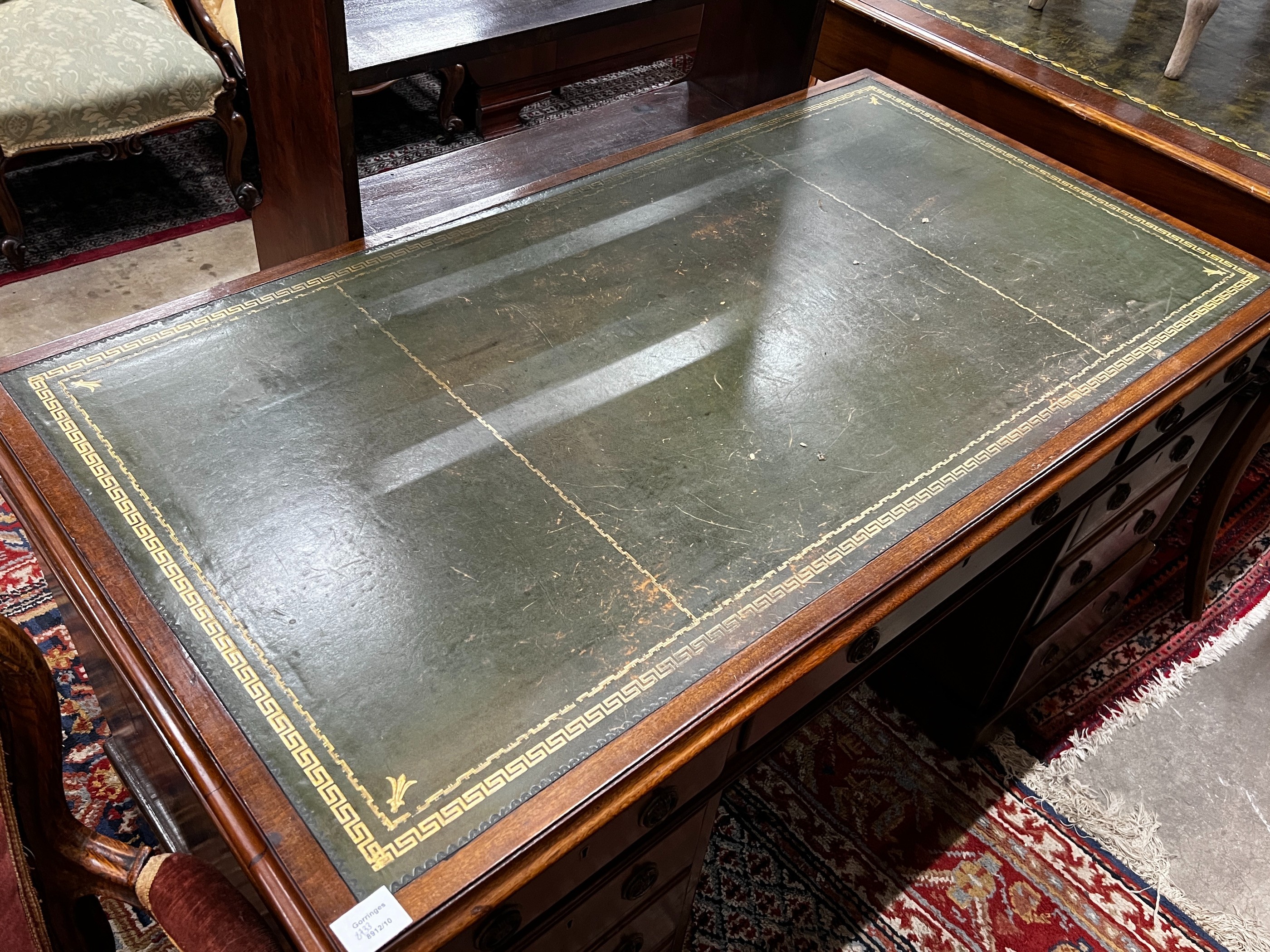 An early 20th century mahogany leather topped pedestal desk, width 137cm, depth 75cm, height 74cm